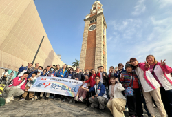 Volunteer and service users took group photo in front of Clock Tower